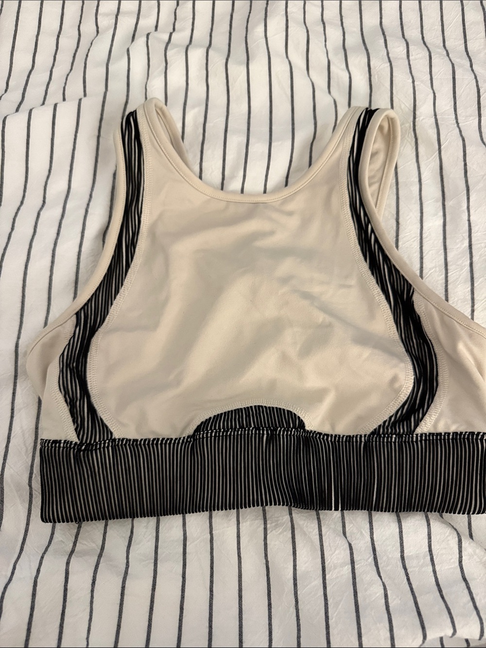 ALO Yoga High-Neck Sports Bra in Cream with Black Trim